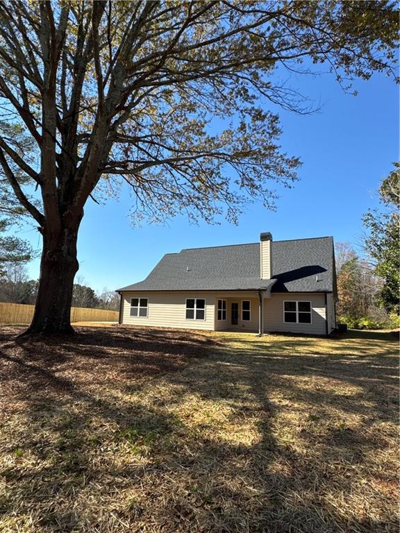 1612 Pickens Street Ball Ground, GA 30107 - Photo 46 of 53 a front view of a house with a yard