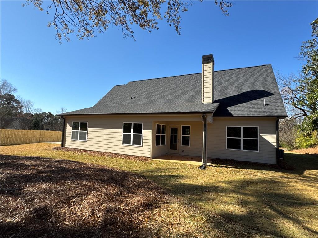 1612 Pickens Street Ball Ground, GA 30107 - Photo 47 of 53 a front view of a house with a yard