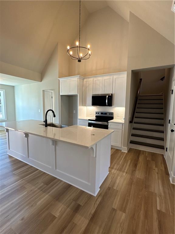 1612 Pickens Street Ball Ground, GA 30107 - Photo 5 of 53 a view of kitchen with sink microwave and stove
