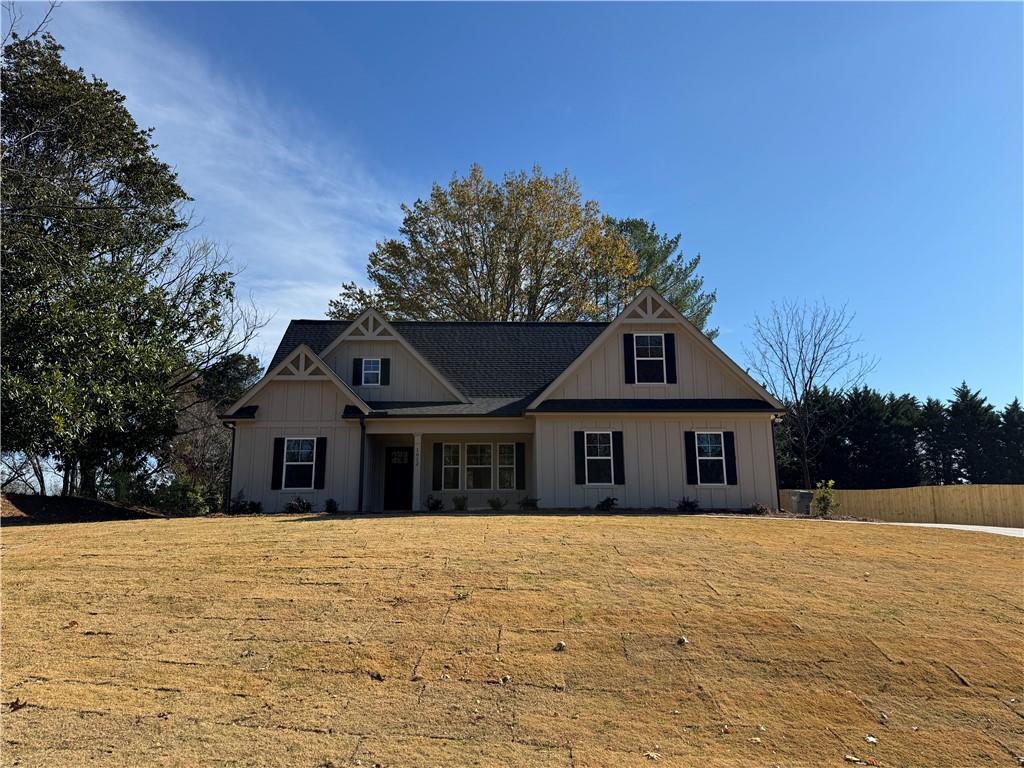 1612 Pickens Street Ball Ground, GA 30107 - Photo 52 of 53 a front view of a house with a garden