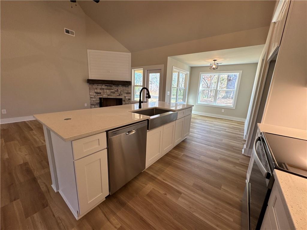 1612 Pickens Street Ball Ground, GA 30107 - Photo 7 of 53 a view of a kitchen with a sink wooden floor and staircase