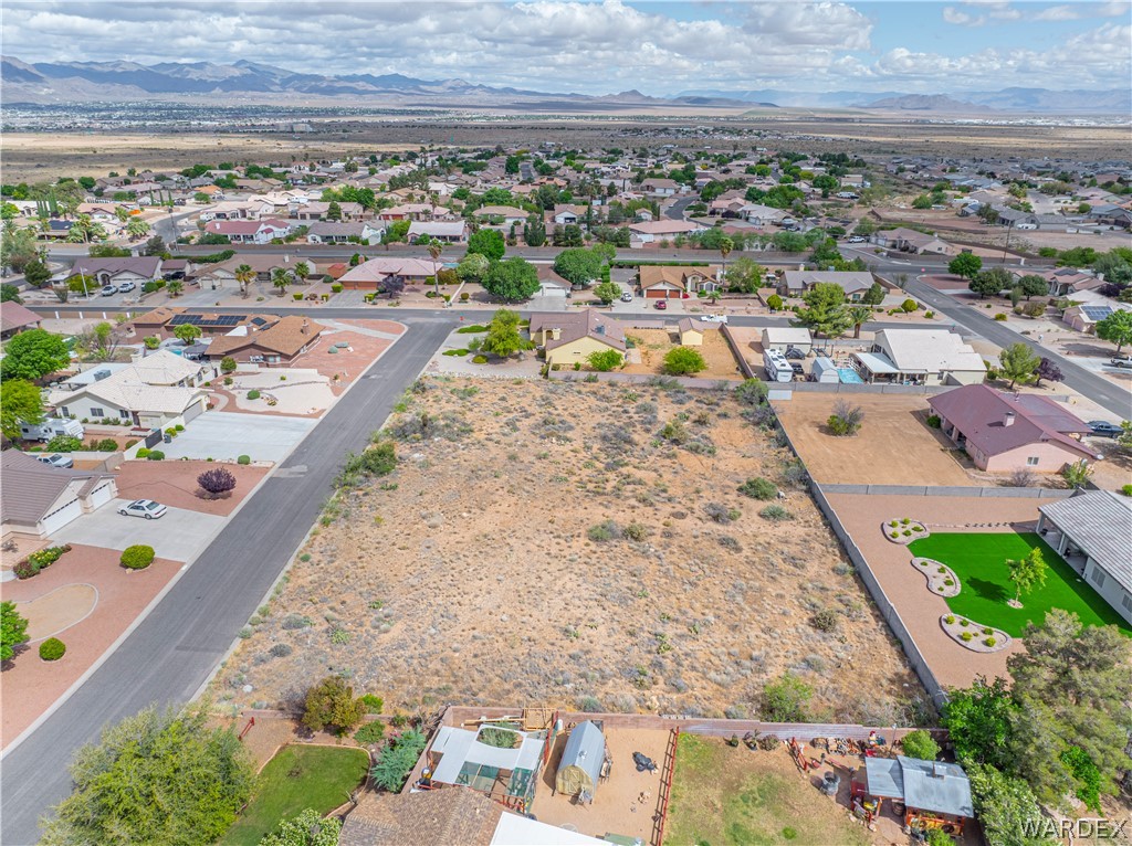 1400 Hidden Canyon Road Kingman, AZ 86401 - Photo 14 of 20 This property features a substantial undeveloped lot, offering expansive open space and direct access to a paved road