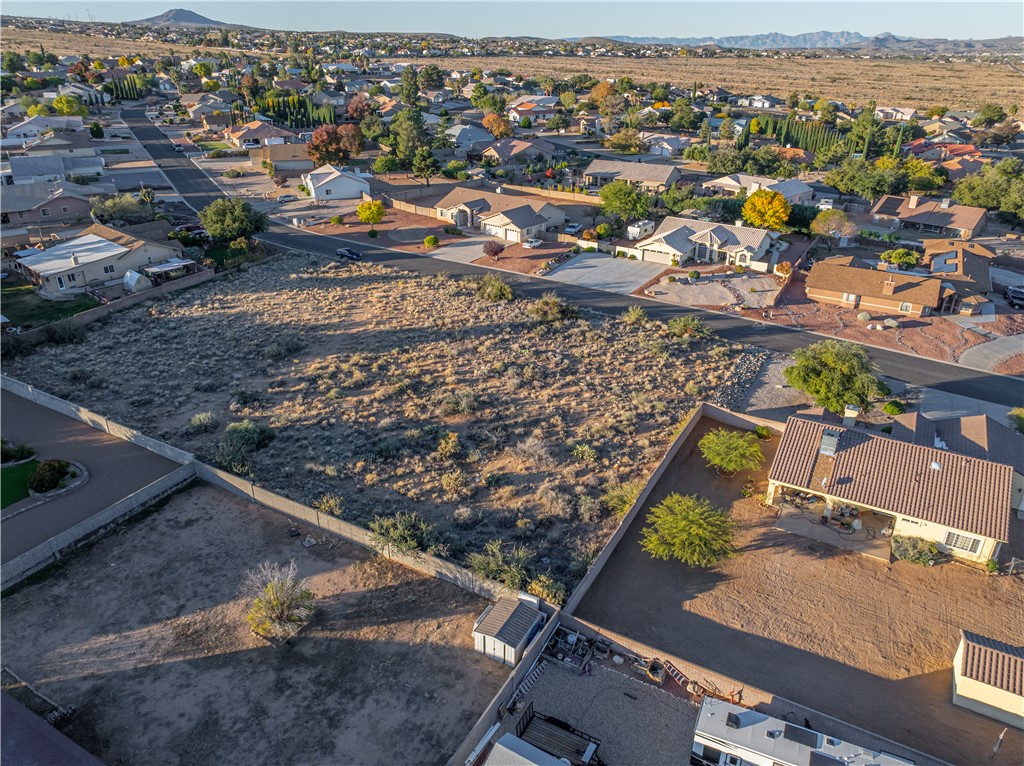 1400 Hidden Canyon Road Kingman, AZ 86401 - Photo 16 of 20 Expansive lot featuring natural landscaping and views of the surrounding neighborhood and distant mountains