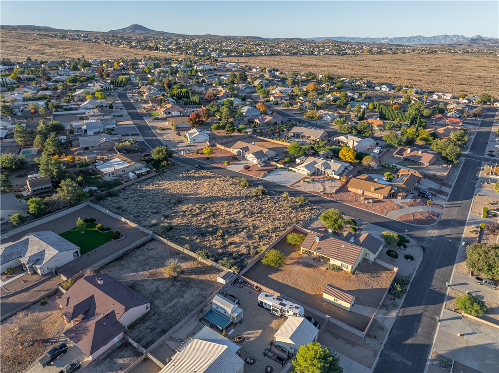 1400 Hidden Canyon Road Kingman, AZ 86401 - Photo 19 of 20 The property features a large lot in a residential area with visible roads and other properties