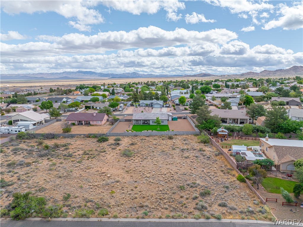 1400 Hidden Canyon Road Kingman, AZ 86401 - Photo 9 of 20 This property features a spacious lot with a clear view of the surrounding neighborhood and distant mountains