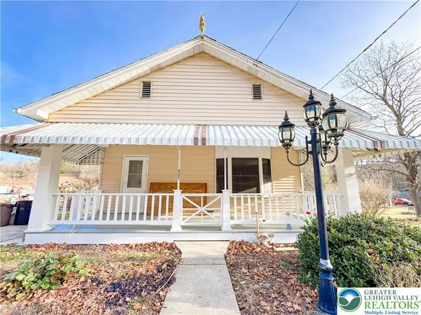 a front view of a house with a porch