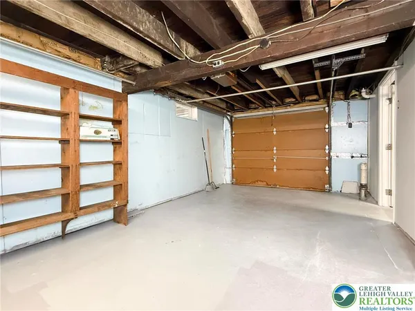 a view of storage and utility room with stairs