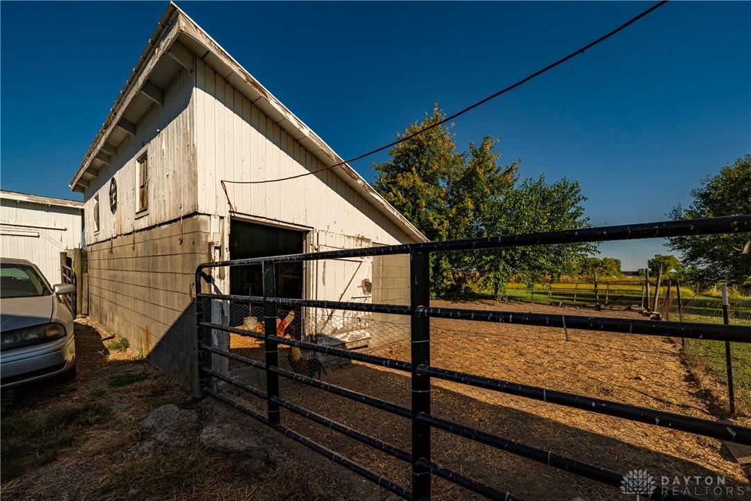 1599 Garringer Road Jamestown, OH 45335 - Photo 55 of 73 This charming barn with a sturdy metal fence awaits your agricultural pursuits.