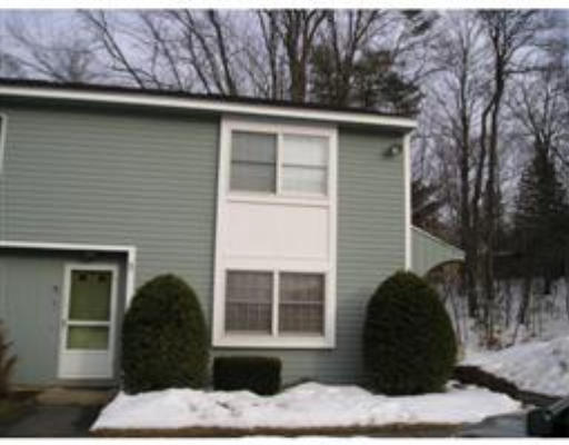 837 Partridgeville Road, Unit D6 Athol, MA 01331 - Photo 1 of 1 a front view of a house with a garden