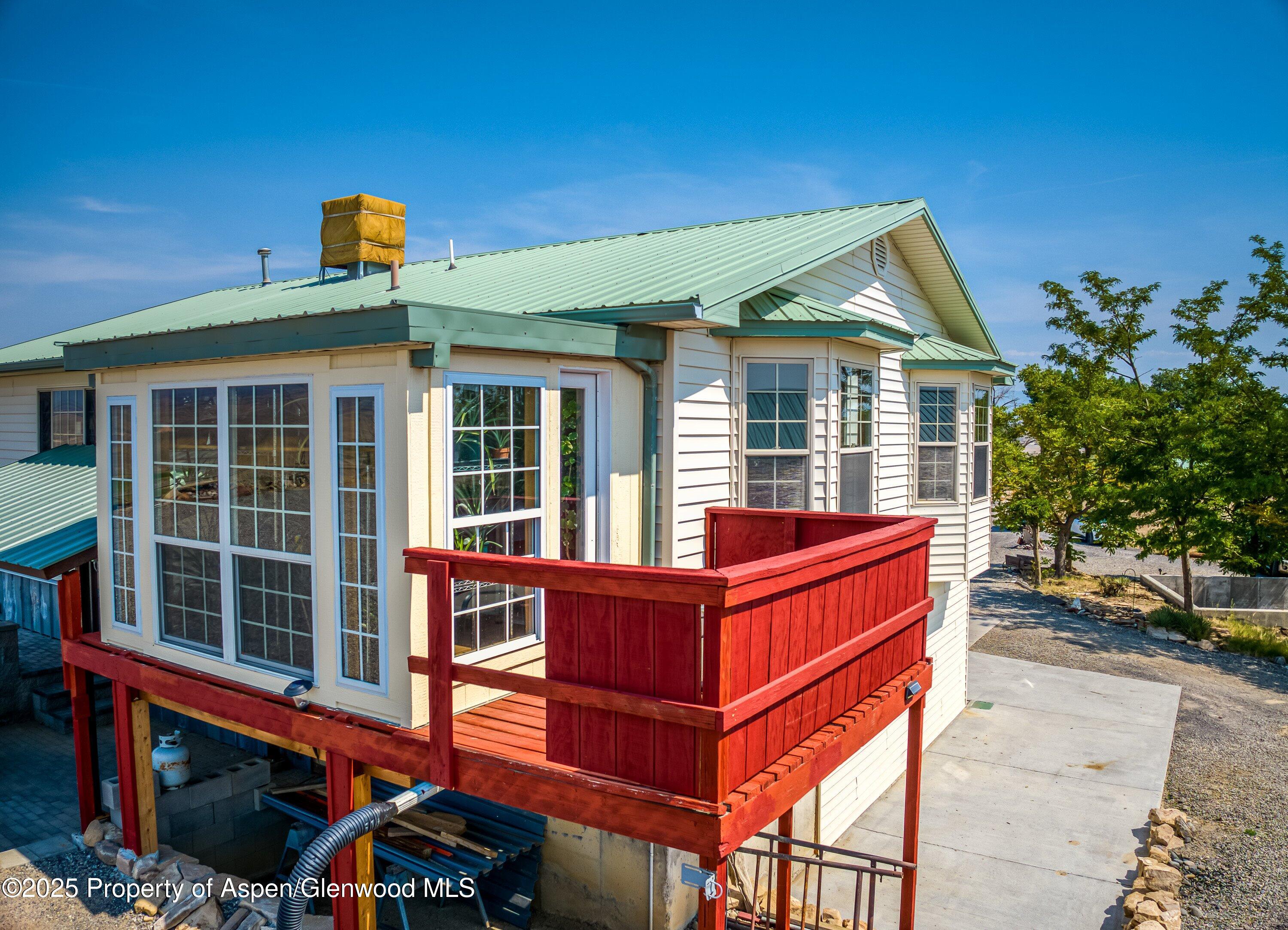 12602 25 Mesa Road Delta, CO 81416 - Photo 49 of 96 a front view of a house with a yard