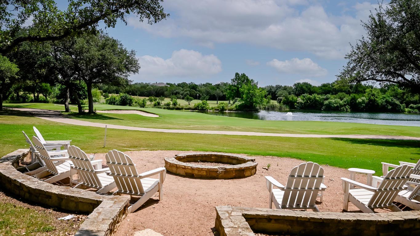 373 Leaning Rock Ridge Austin, TX 78737 - Photo 27 of 39 a view of a swimming pool and lounge chairs