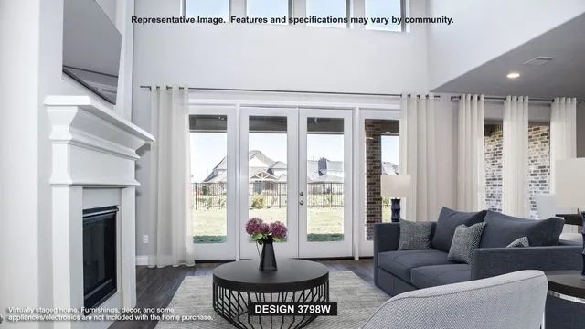 a living room with furniture fireplace and a large window