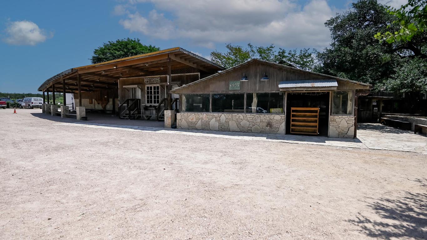 373 Leaning Rock Ridge Austin, TX 78737 - Photo 31 of 39 a front view of a house with a yard and garage