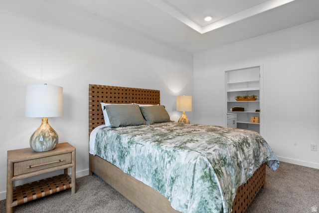 1624 South Staircase Way, Unit 4183 Washington, UT 84780 - Photo 11 of 47 Neutral wall tones, recessed lighting, and tray ceiling detail