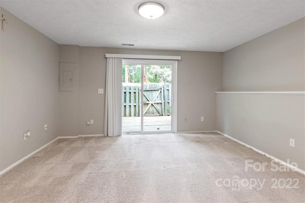 1235 Scaleybark Road, Unit E Charlotte, NC 28209 - Photo 11 of 23 a view of an empty room with a window