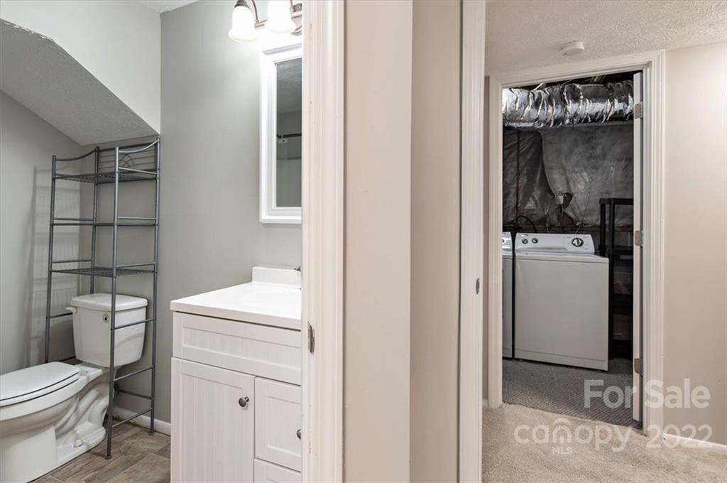 1235 Scaleybark Road, Unit E Charlotte, NC 28209 - Photo 13 of 23 a bathroom with a toilet a sink and shower