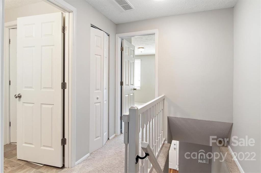 1235 Scaleybark Road, Unit E Charlotte, NC 28209 - Photo 16 of 23 a view of a hallway with entryway door