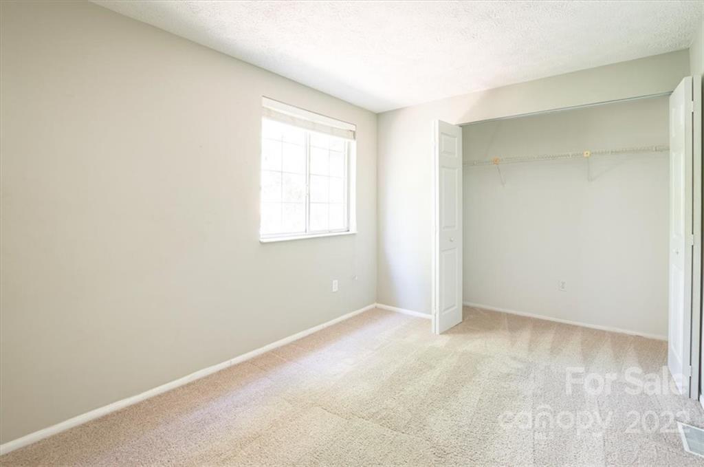 1235 Scaleybark Road, Unit E Charlotte, NC 28209 - Photo 18 of 23 an empty room with windows
