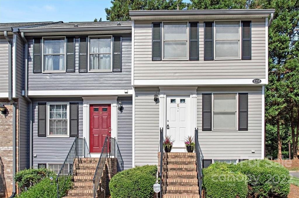 1235 Scaleybark Road, Unit E Charlotte, NC 28209 - Photo 2 of 23 a front view of a house with plants