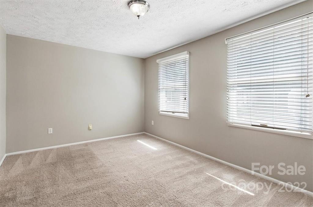 1235 Scaleybark Road, Unit E Charlotte, NC 28209 - Photo 22 of 23 a view of an empty room with a window