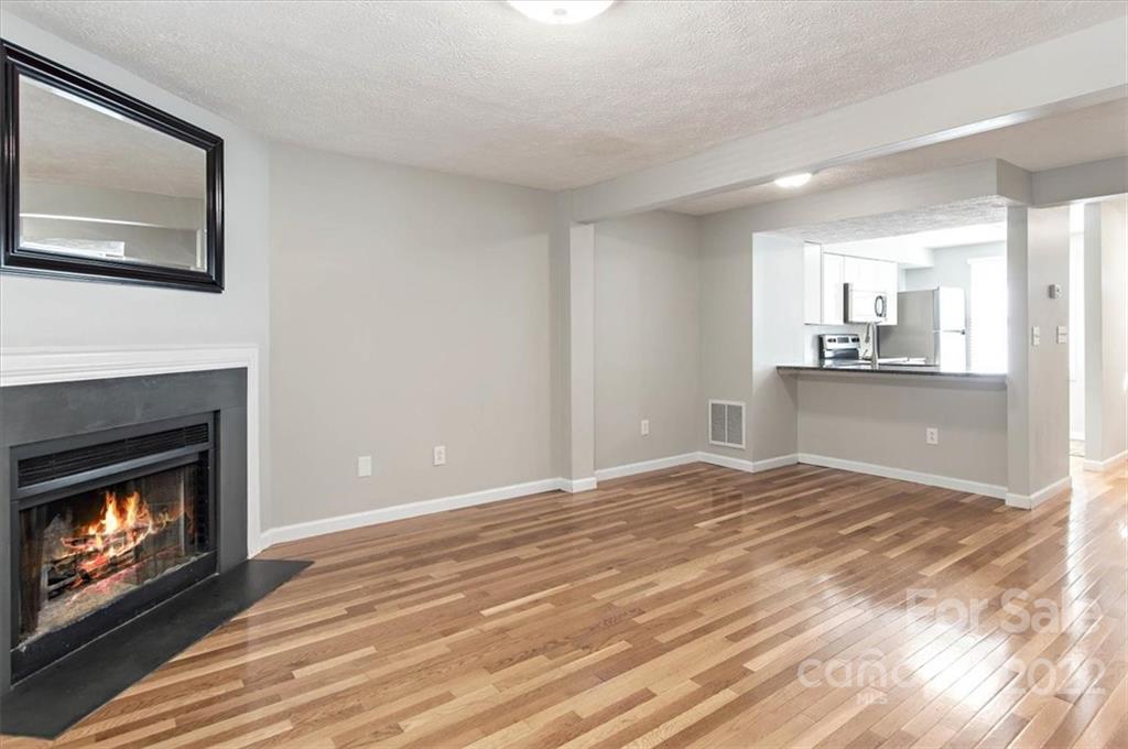 1235 Scaleybark Road, Unit E Charlotte, NC 28209 - Photo 8 of 23 a view of a kitchen and an empty room