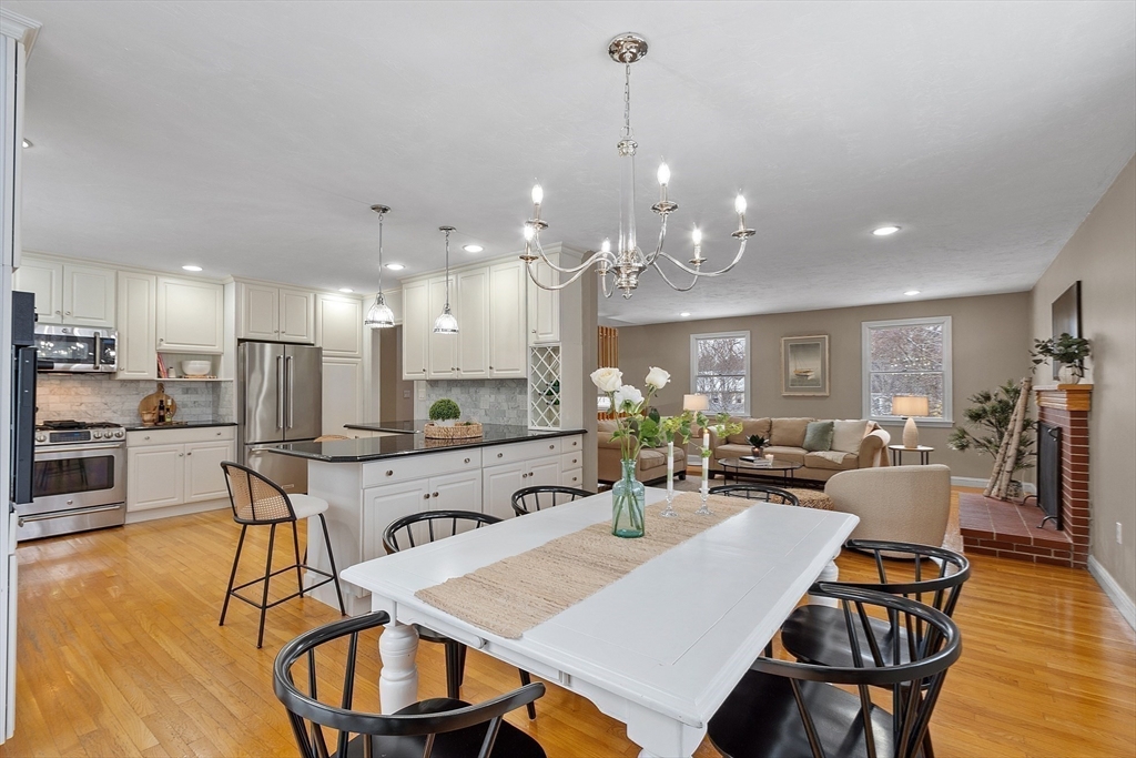 30 Duck Road Reading, MA 01867 - Photo 12 of 42 a large kitchen with a table and chairs