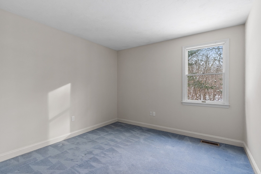 30 Duck Road Reading, MA 01867 - Photo 21 of 42 an empty room with a window