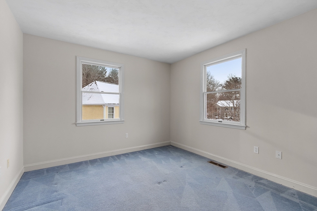 30 Duck Road Reading, MA 01867 - Photo 23 of 42 an empty room with windows