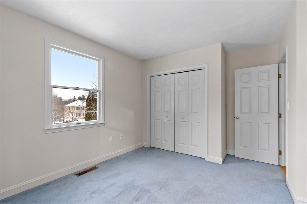 30 Duck Road Reading, MA 01867 - Photo 24 of 42 an empty room with windows and closet