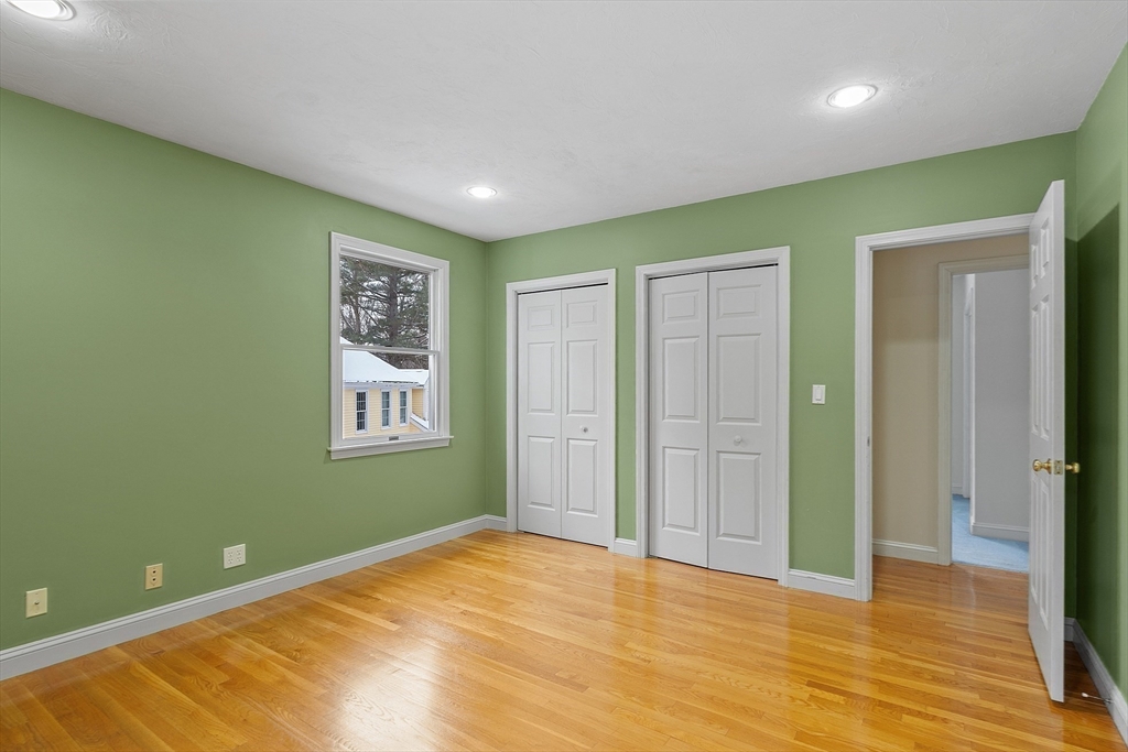 30 Duck Road Reading, MA 01867 - Photo 26 of 42 a view of empty room with window and wooden floor