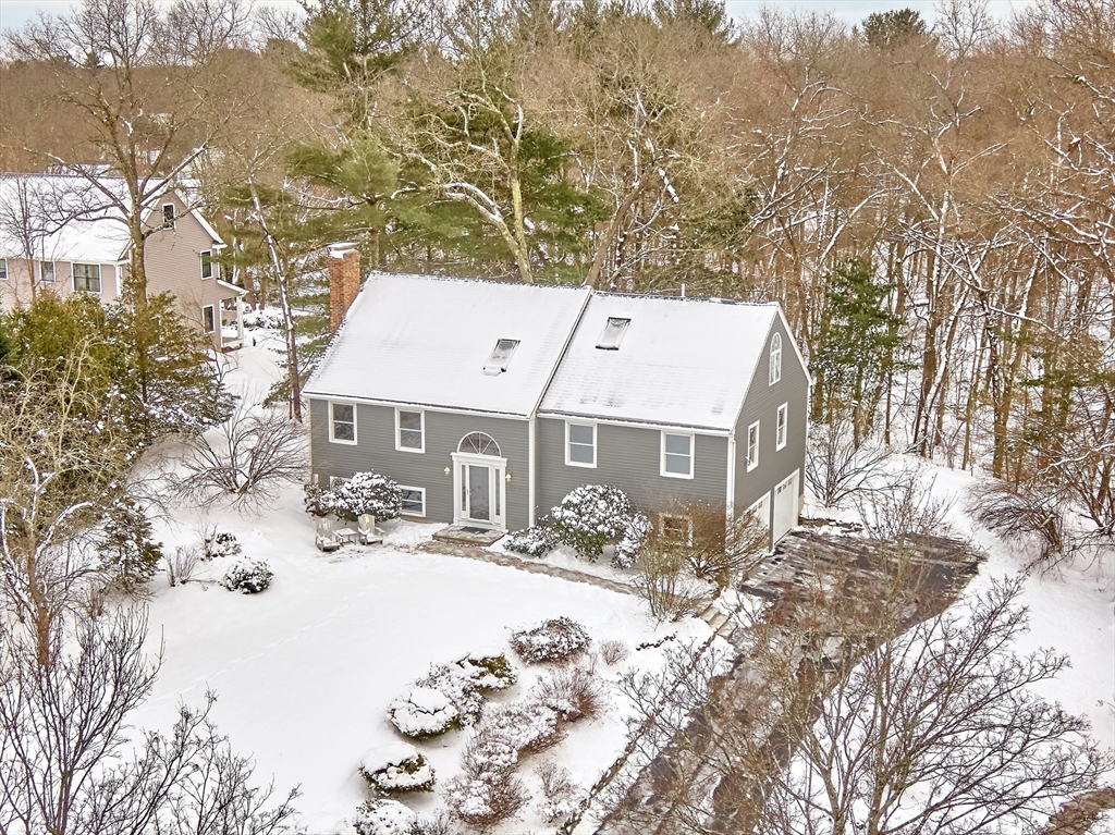 30 Duck Road Reading, MA 01867 - Photo 3 of 42 a view of a house with a yard covered in snow