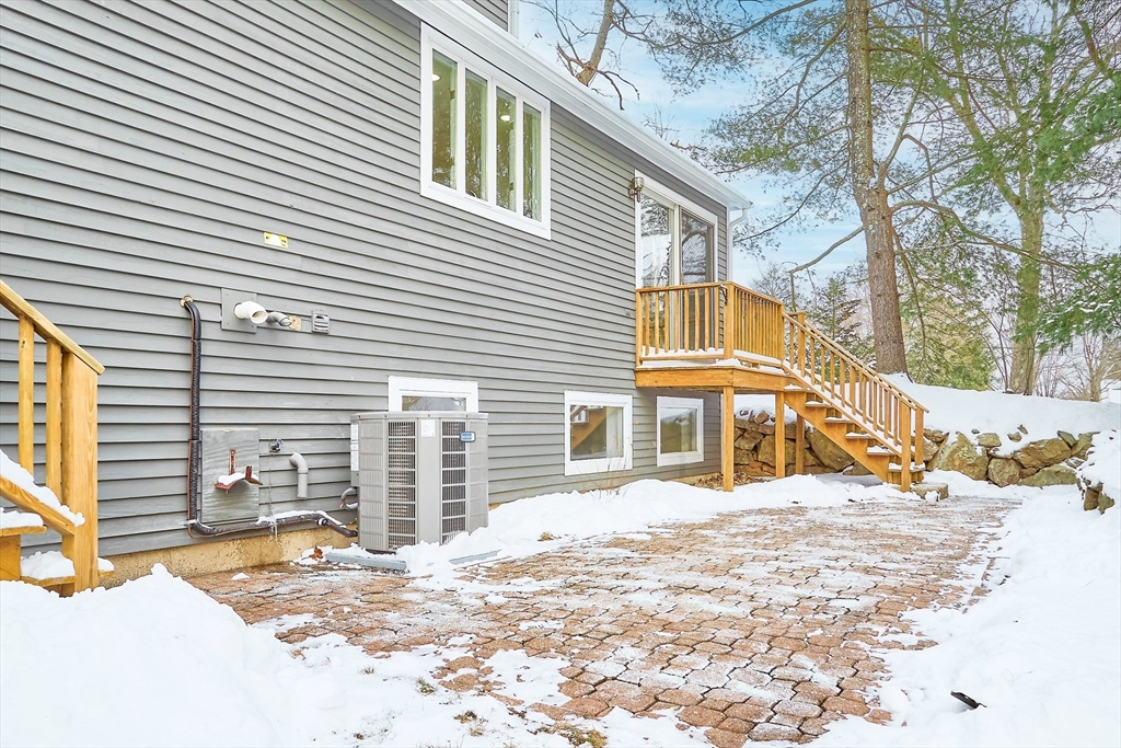 30 Duck Road Reading, MA 01867 - Photo 40 of 42 a view of a house with snow on the road