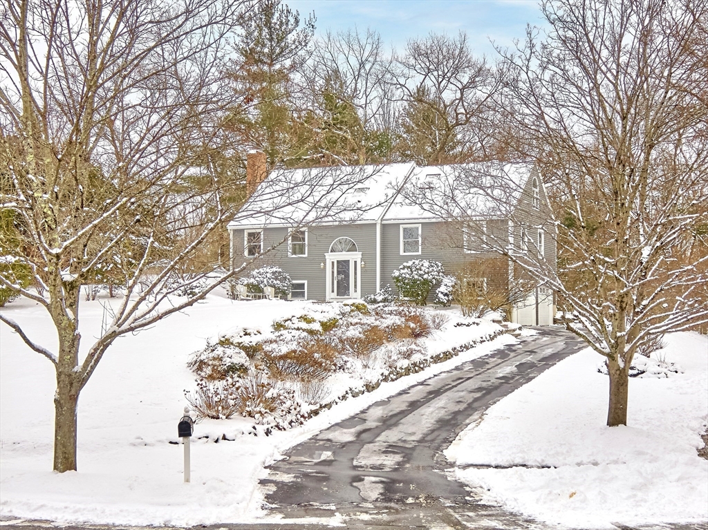 30 Duck Road Reading, MA 01867 - Photo 4 of 42 a view of a house with a yard covered in snow