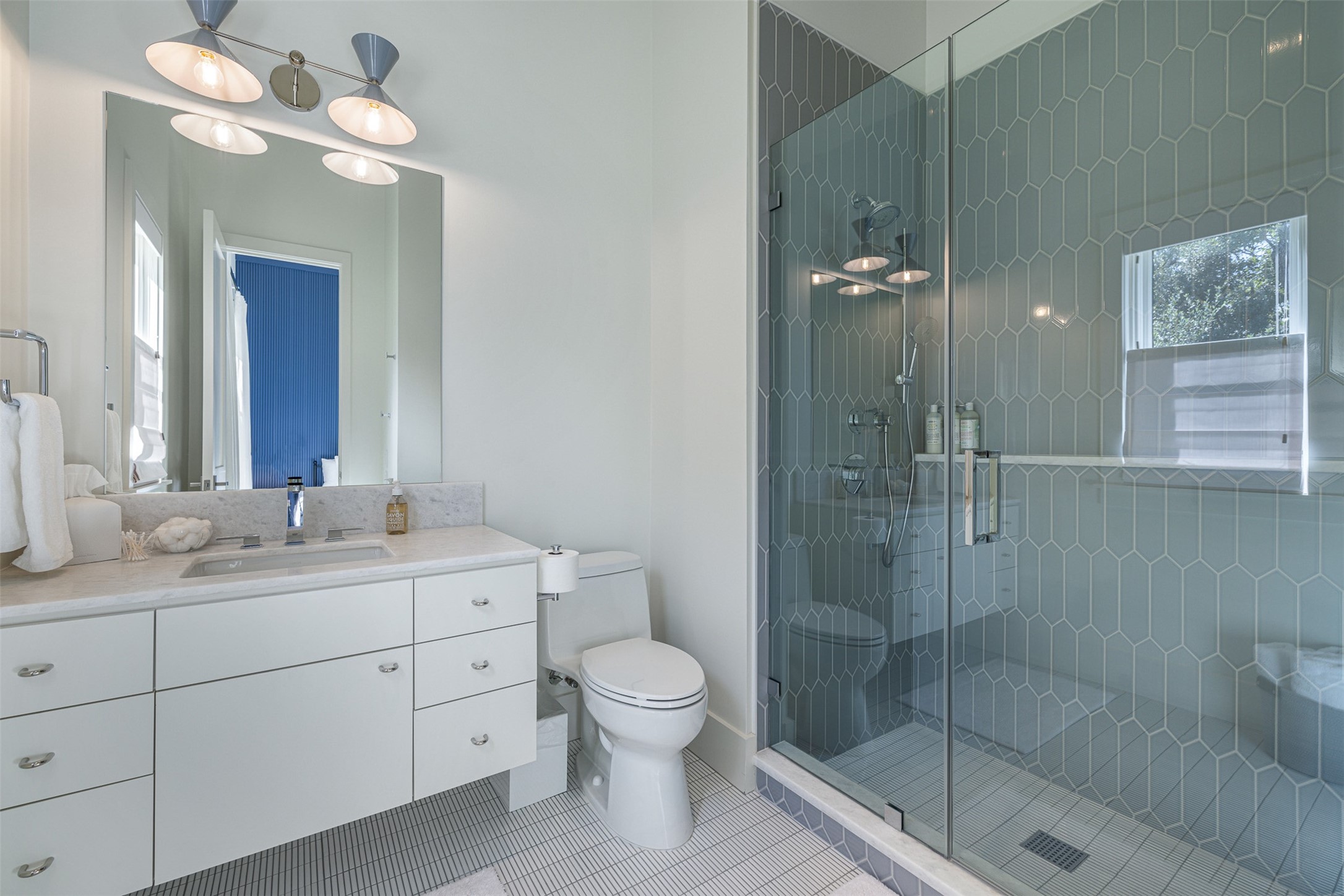 830 South Weyand Road Round Top, TX 78954 - Photo 16 of 36 a bathroom with a toilet a sink and a shower