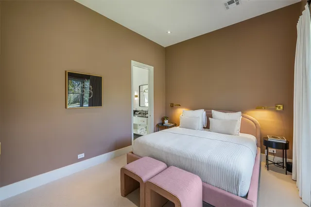 a bedroom with a bed and a table