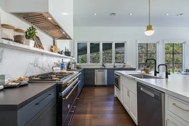 a kitchen with a stove and a sink