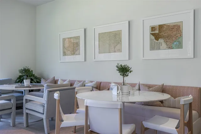 a dining room with furniture and wooden floor