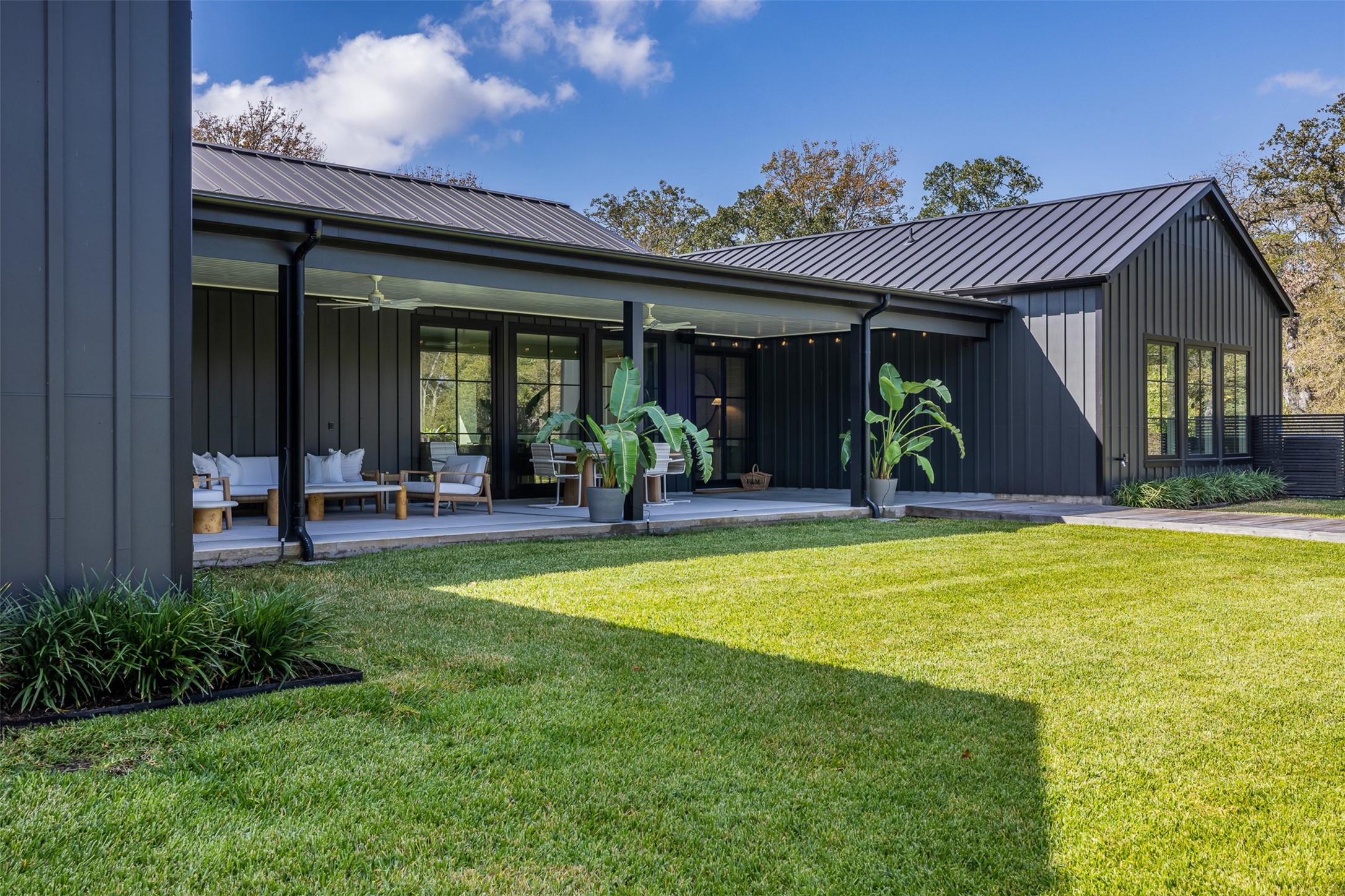 830 South Weyand Road Round Top, TX 78954 - Photo 26 of 36 a view of a house with a swimming pool and porch