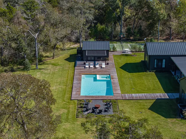 a view of a swimming pool with a garden and plants