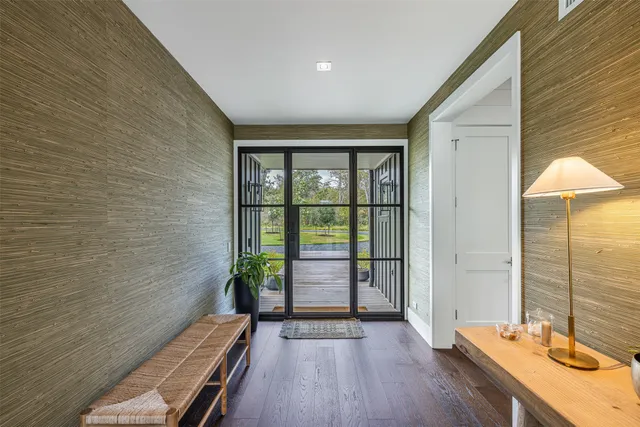 a view of a balcony with wooden floor