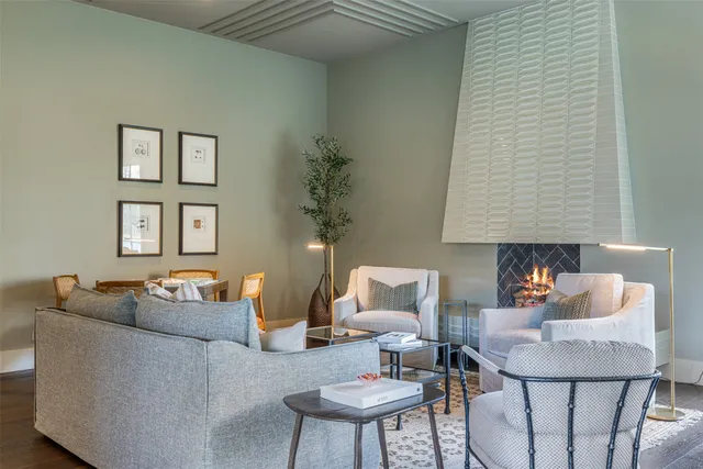 a living room with furniture and a lamp