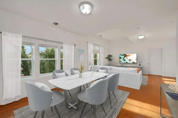 a view of a dining room with furniture window and outside view