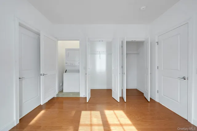 a view of bedroom with wooden floor