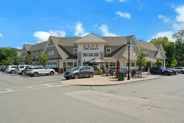 a view of a cars park in front of house