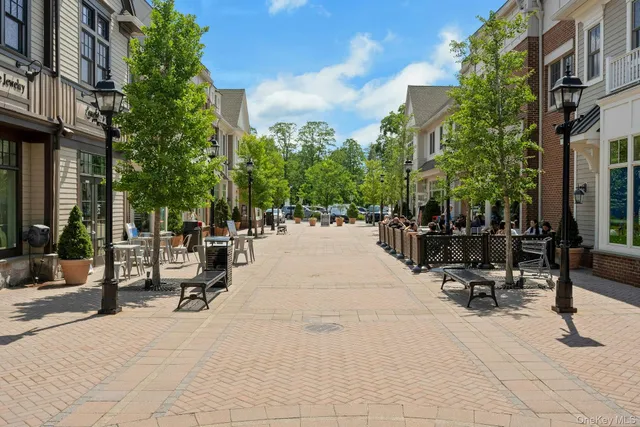 a view of a street with sitting area
