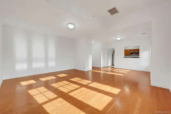 a view of a kitchen with a sink and a window