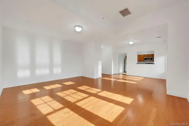 a view of a kitchen with a sink and a window