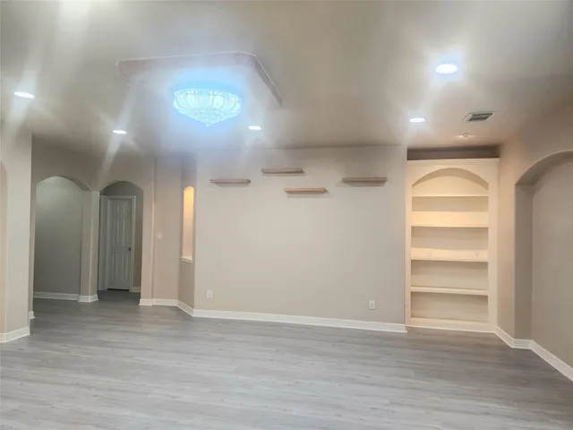 a view of an empty room with a window