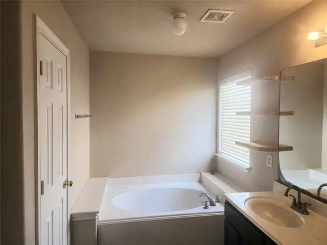 a bathroom with a sink and a bathtub