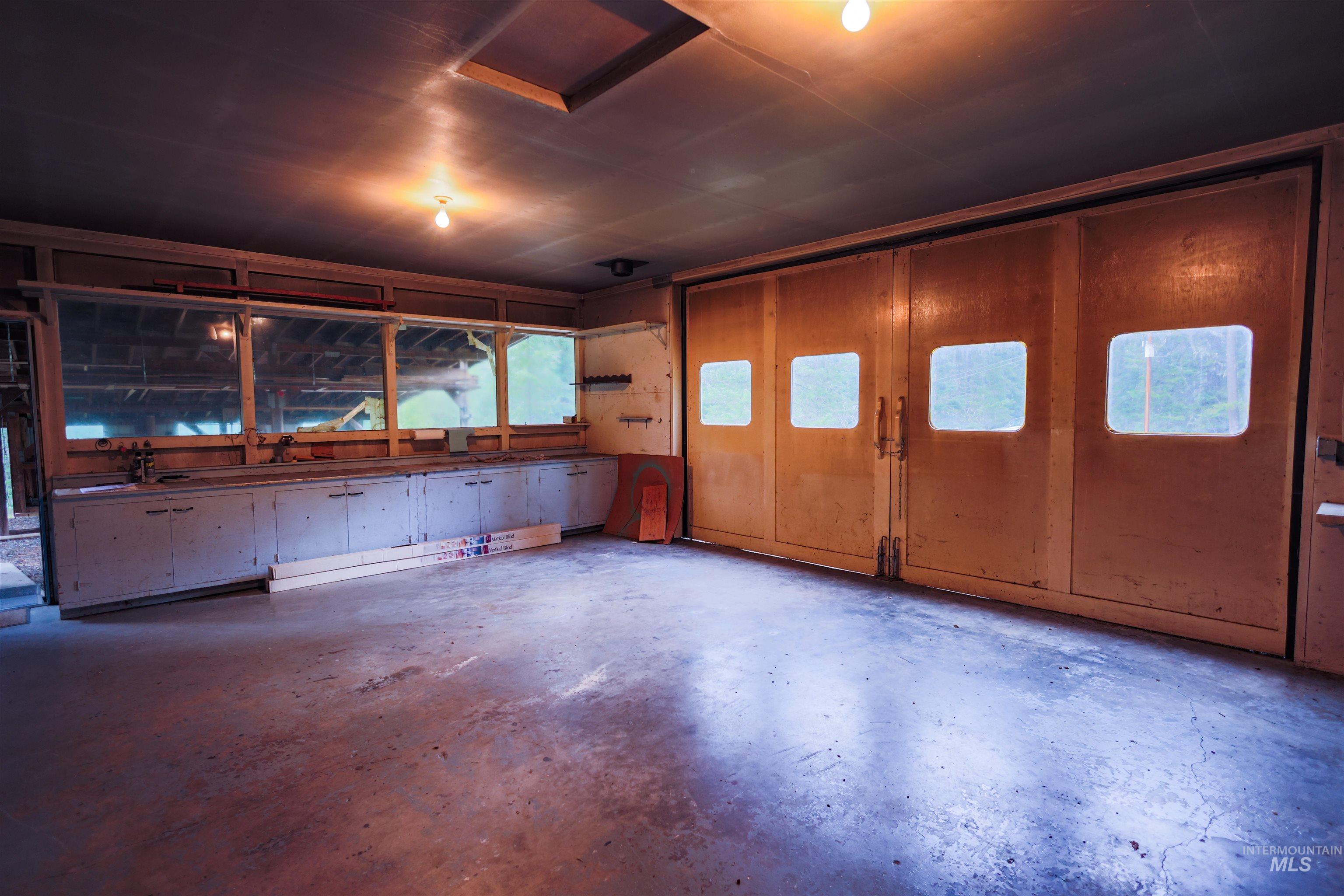717 Big Cedar Road Kooskia, ID 83539 - Photo 23 of 50 Miscellaneous room with a garage and concrete floors